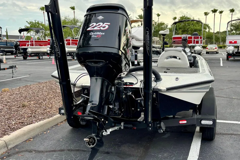 Slide: The Image of 2006 Champion 198 Elite boat with OptiMax Pro XS engine in parking lot. - 3