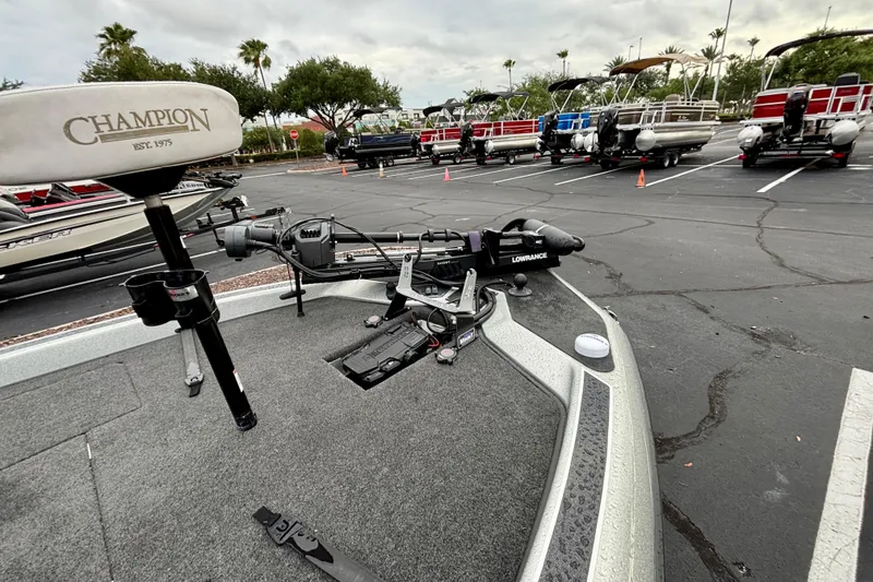 Slide: The Image of 2006 Champion 198 Elite boat with trolling motor in parking lot. - 8