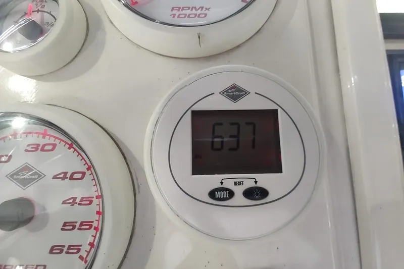 Slide: The Image of Close-up of Intrepid 322 Cuddy 1994 boat gauges displaying RPM and digital reading. - 15