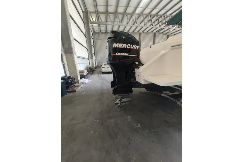 Slide: The Image of 1994 Intrepid 322 Cuddy with Mercury outboard engine in a storage facility. - 9