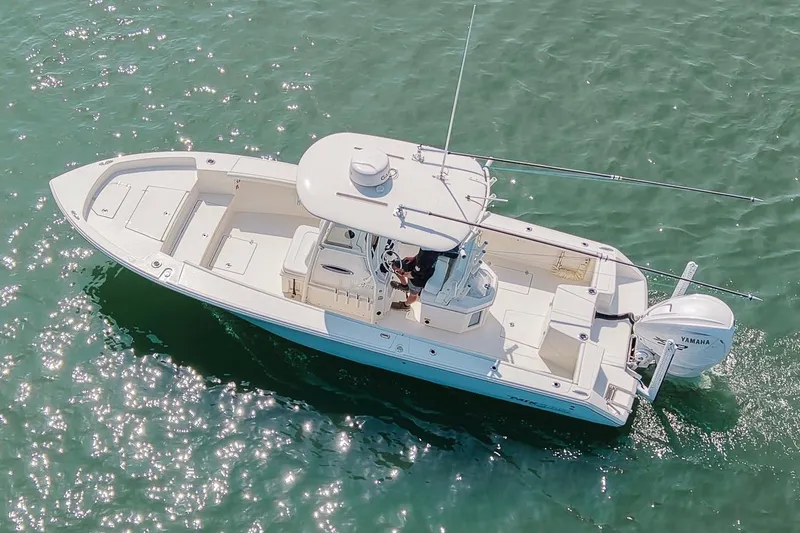 Slide: The Image of 2024 Pathfinder 2700 Open boat cruising on clear blue water. - 11
