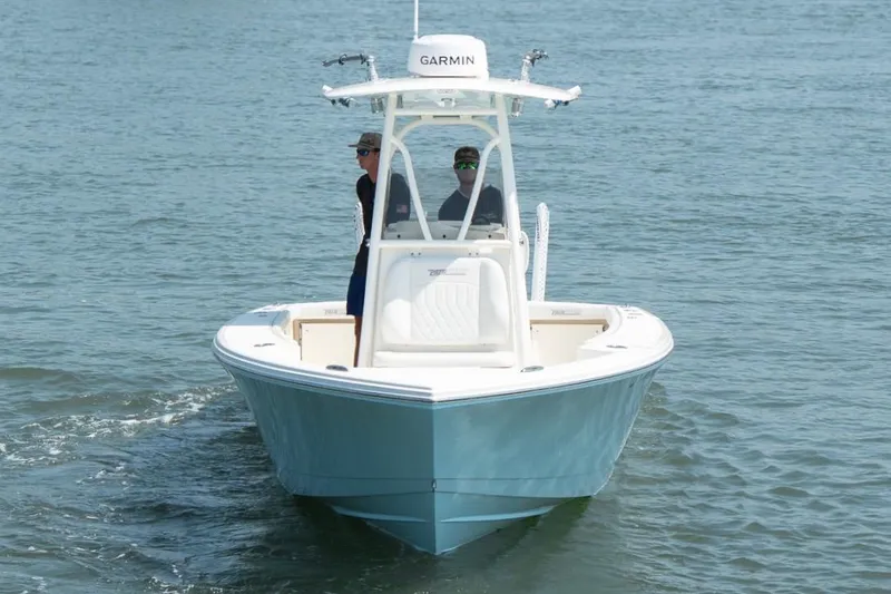 Slide: The Image of 2024 Pathfinder 2700 Open boat cruising on water with Garmin equipment. - 13