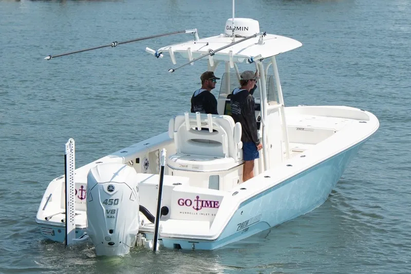 Slide: The Image of 2024 Pathfinder 2700 Open boat on water with two people onboard. - 3