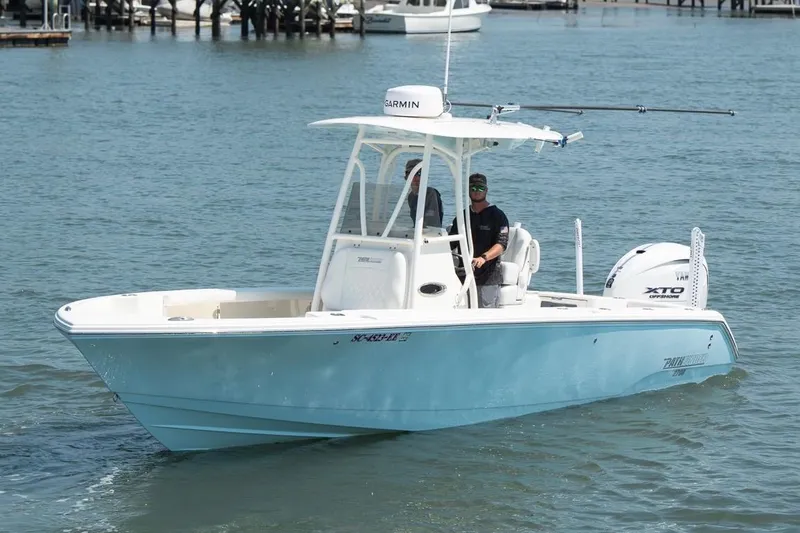 Slide: The Image of 2024 Pathfinder 2700 Open boat cruising on water with Garmin equipment and Yamaha XTO engine. - 6