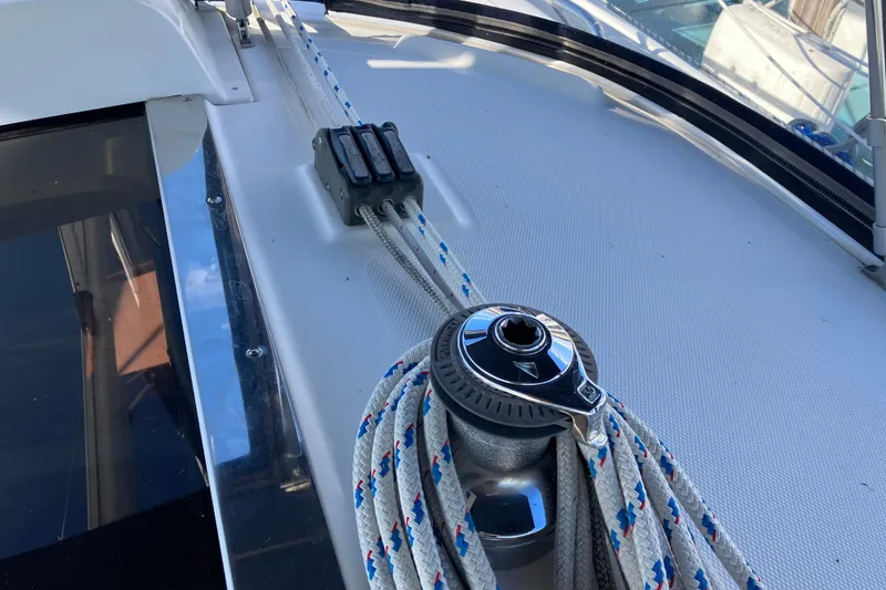 Slide: The Image of Winch and ropes on 2005 Hunter 36 sailboat deck, showcasing marine equipment. - 22