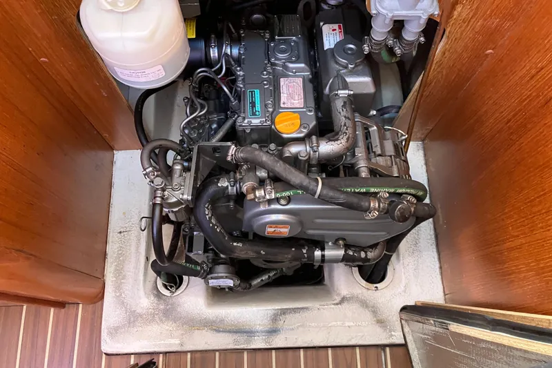 Slide: The Image of Engine compartment of a 2005 Hunter 36 sailboat, showcasing detailed mechanical components. - 46