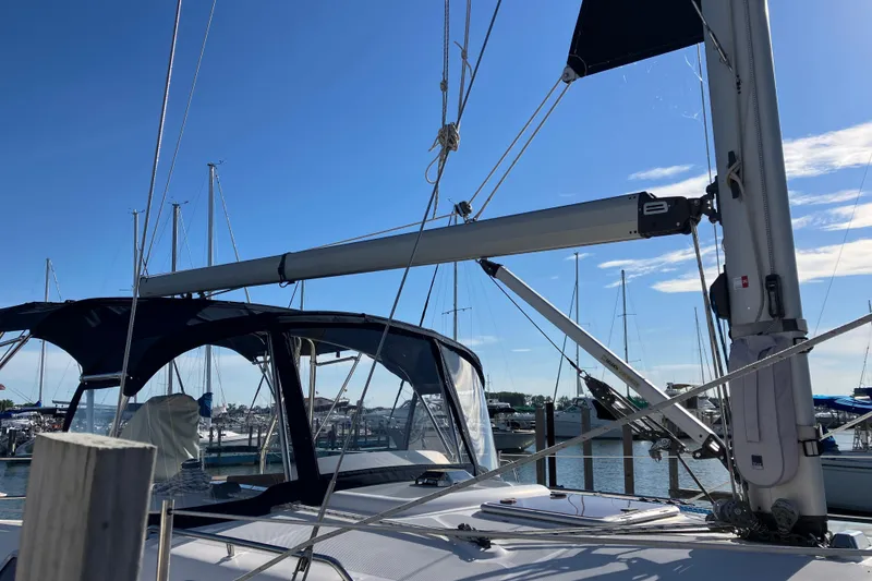 Slide: The Image of Sailboat Hunter 36, 2005 model, docked at marina under clear blue sky. - 7