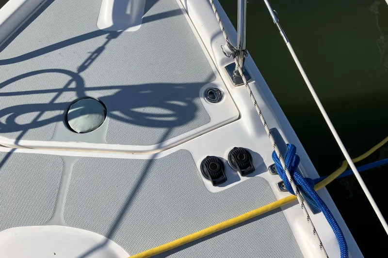 Slide: The Image of Deck of 2005 Hunter 36 sailboat with ropes and fittings. - 16