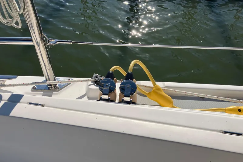 Slide: The Image of Deck of 2005 Hunter 36 sailboat with winch and yellow rope. - 24