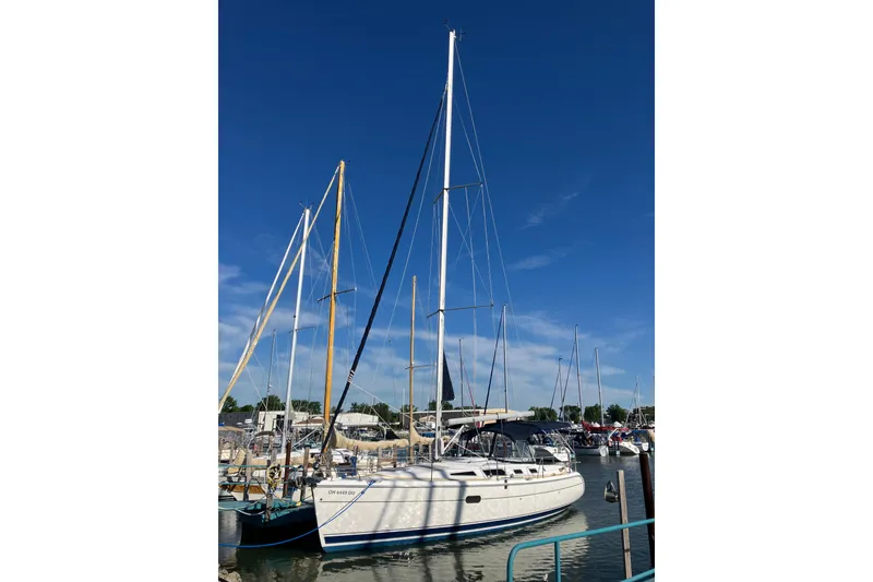 Slide: The Image of Sailboat docked in marina, Hunter 36 model, 2005, under clear blue sky. - 4
