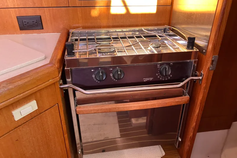 Slide: The Image of Stainless steel stove and oven in a 2005 Hunter 36 yacht kitchen. - 31