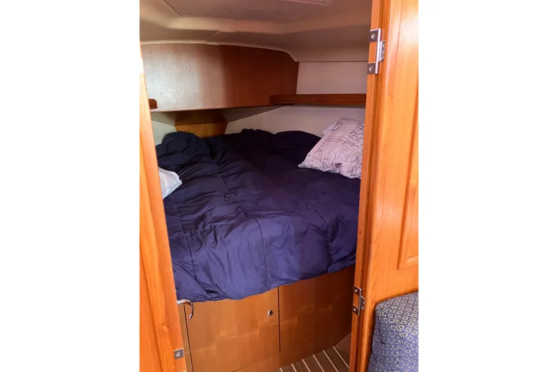 Slide: The Image of Cozy cabin interior of 2005 Hunter 36 sailboat with comfortable bedding. - 38
