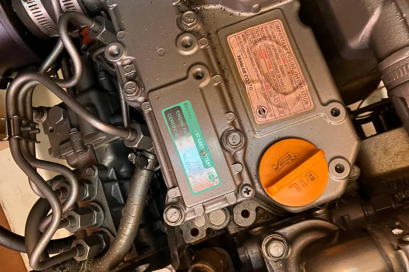 Slide: The Image of Close-up of a 2005 Hunter 36 engine with visible oil cap and labels. - 47