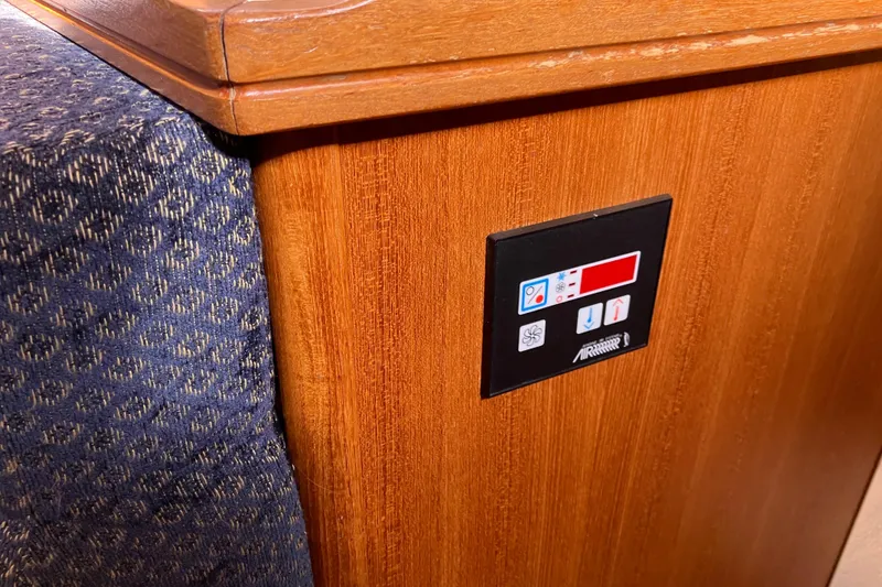 Slide: The Image of Control panel on wooden interior of 2005 Hunter 36 yacht. - 32
