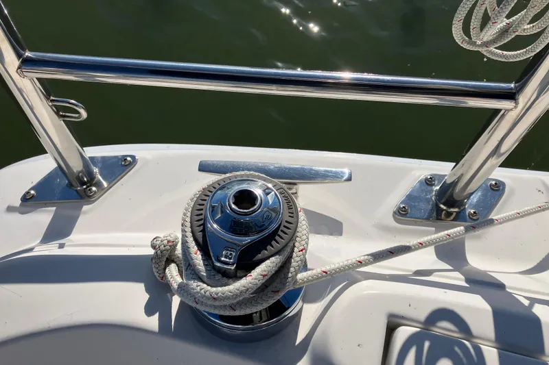 Slide: The Image of Winch and rope on a 2005 Hunter 36 sailboat deck, near water. - 25