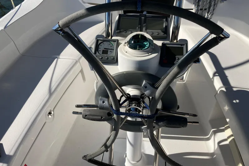 Slide: The Image of Steering wheel and navigation instruments on a 2005 Hunter 36 sailboat. - 55