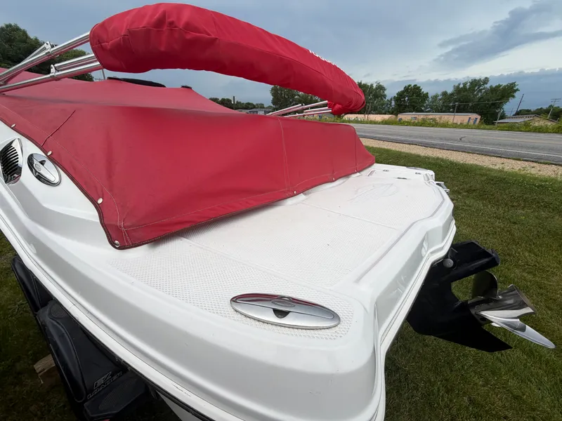 Slide: The Image of Chaparral 206 SSi 2012 with red cover and outboard motor. - 7