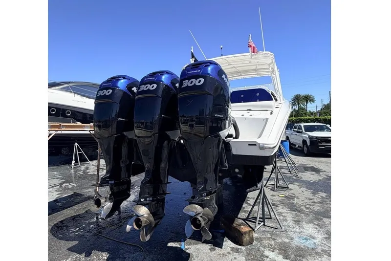 Slide: The Image of 2008 Midnight Express 37 Cabin boat with triple 300 horsepower engines on display. - 13