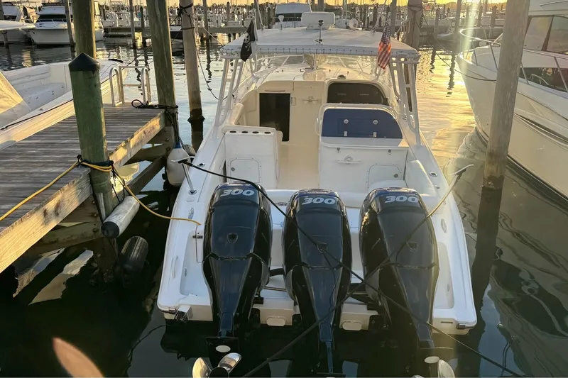 Slide: The Image of 2008 Midnight Express 37 Cabin boat docked with triple 300 horsepower engines. - 3