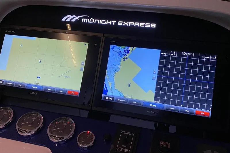 Slide: The Image of Dashboard of 2008 Midnight Express 37 Cabin with Garmin navigation displays. - 4