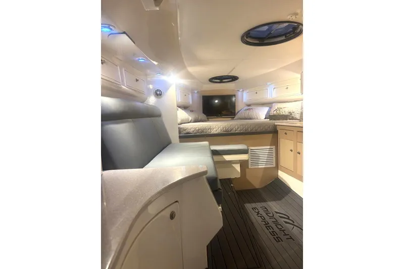 Slide: The Image of Luxurious interior of 2008 Midnight Express 37 Cabin boat with seating and sleeping area. - 5