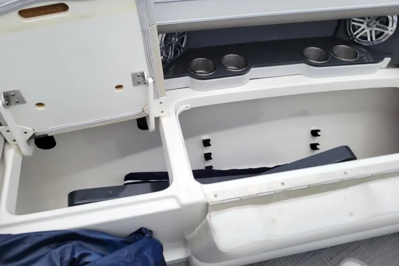 Slide: The Image of Open storage compartments on a 2019 Formula 350 Crossover Bowrider boat. - 17
