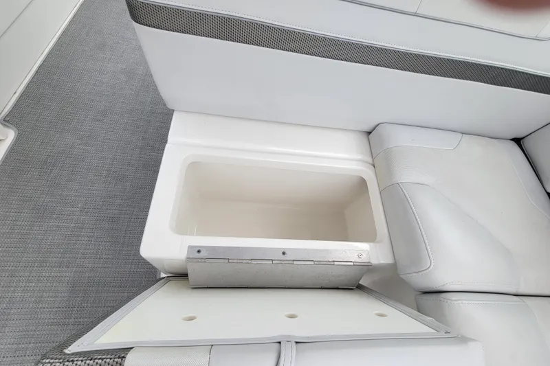 Slide: The Image of 2019 Formula 350 Crossover Bowrider storage compartment with open lid, showcasing interior space. - 18