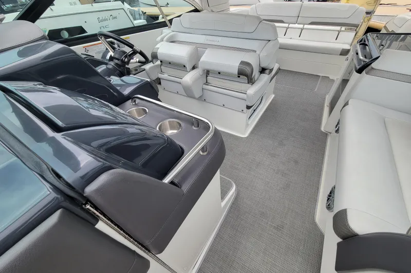 Slide: The Image of 2019 Formula 350 Crossover Bowrider interior with luxurious seating and modern helm design. - 20
