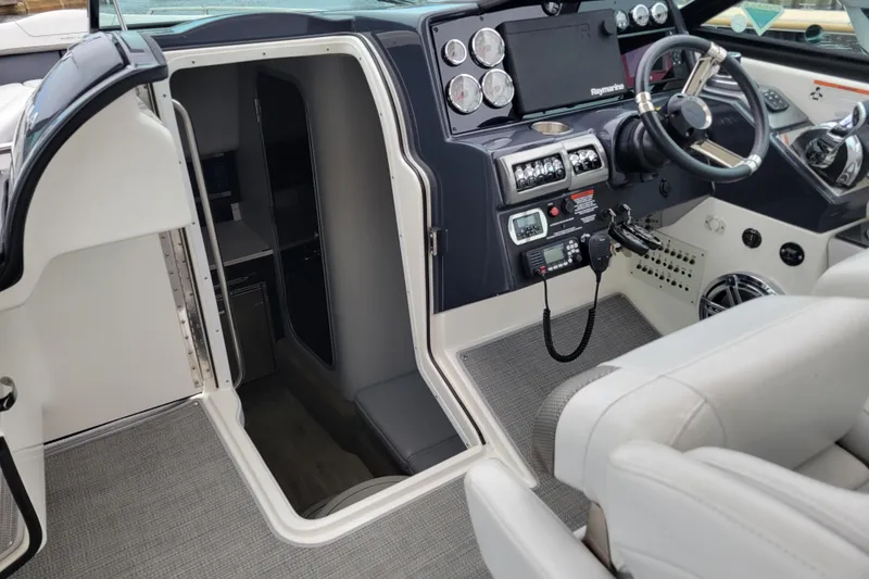 Slide: The Image of 2019 Formula 350 Crossover Bowrider cockpit with modern controls and cabin entrance. - 21