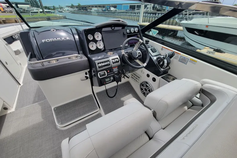 Slide: The Image of 2019 Formula 350 Crossover Bowrider cockpit with modern controls and luxurious seating. - 22