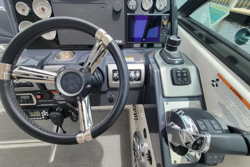 Slide: The Image of Cockpit of 2019 Formula 350 Crossover Bowrider with steering wheel and control panel. - 23