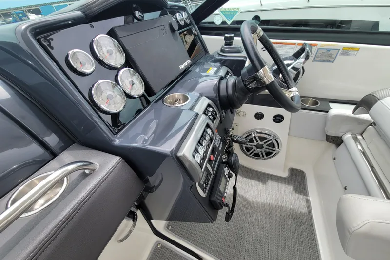 Slide: The Image of 2019 Formula 350 Crossover Bowrider dashboard with gauges, steering wheel, and controls. - 24