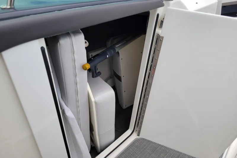 Slide: The Image of Storage compartment in a 2019 Formula 350 Crossover Bowrider boat, featuring interior equipment. - 26