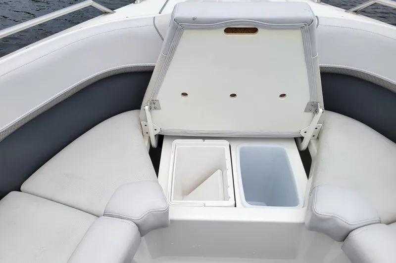 Slide: The Image of 2019 Formula 350 Crossover Bowrider with open storage compartments and cushioned seating. - 29