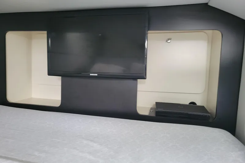 Slide: The Image of Interior of 2019 Formula 350 Crossover Bowrider with TV and storage compartments. - 36