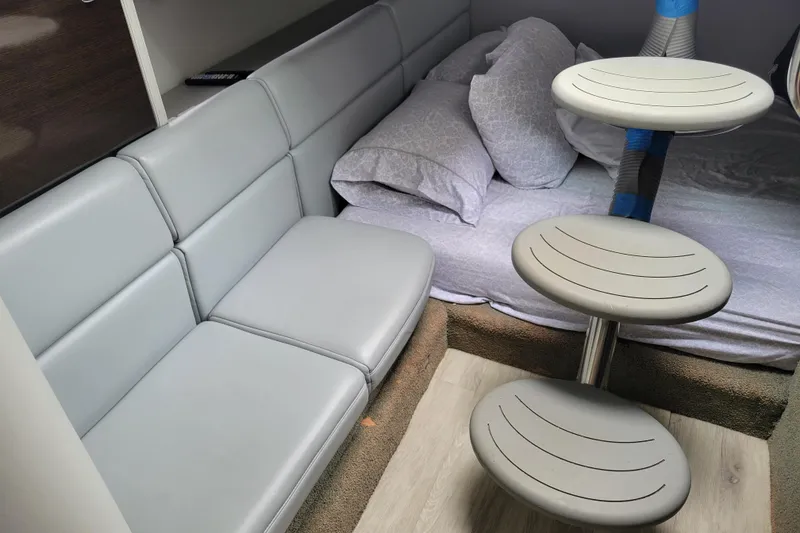 Slide: The Image of Interior of 2019 Formula 350 Crossover Bowrider with seating and bedding area. - 37