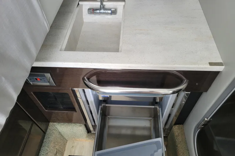 Slide: The Image of 2019 Formula 350 Crossover Bowrider interior with sink and storage drawers. - 40