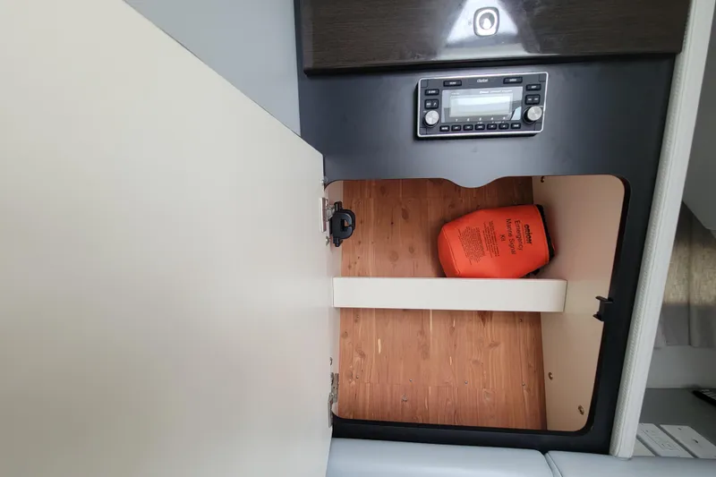 Slide: The Image of 2019 Formula 350 Crossover Bowrider interior storage with emergency marine signal kit. - 42
