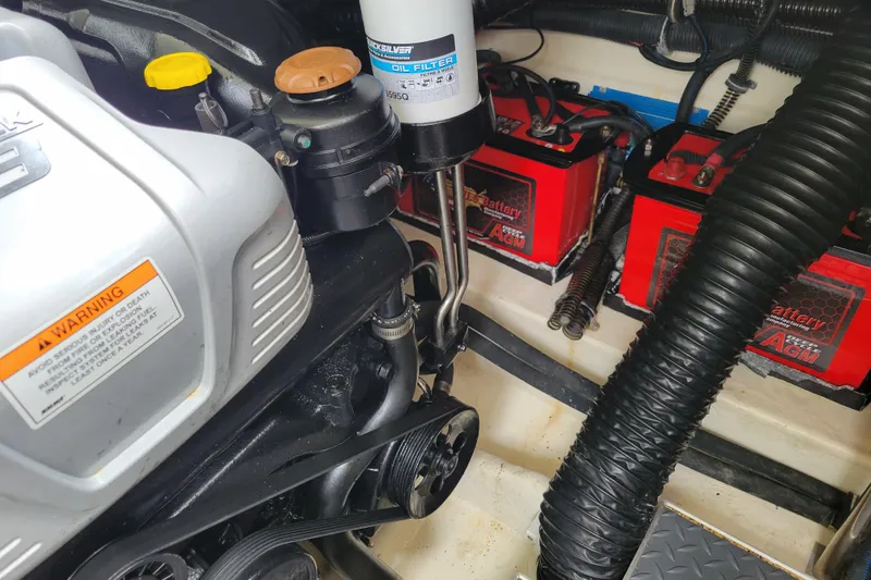 Slide: The Image of Engine compartment of a 2019 Formula 350 Crossover Bowrider with batteries and oil filter. - 50