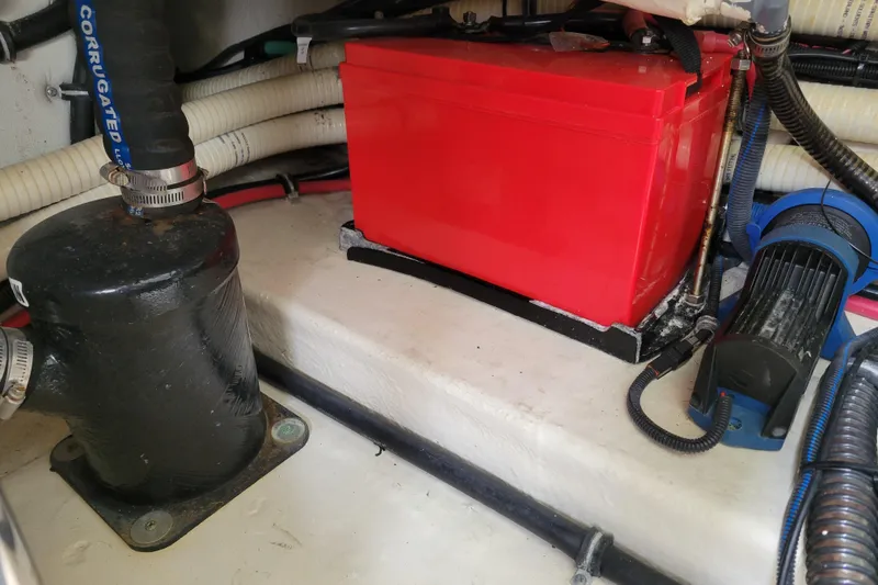 Slide: The Image of Engine compartment of 2019 Formula 350 Crossover Bowrider with red battery and hoses. - 52