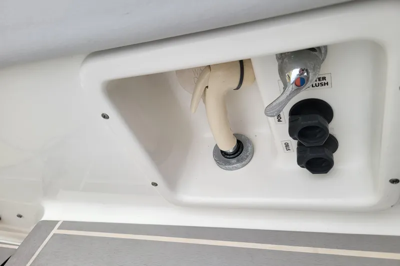Slide: The Image of 2019 Formula 350 Crossover Bowrider water flush system with faucet and hose. - 8