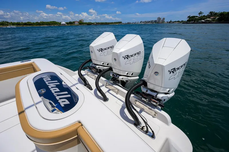 Slide: The Image of 2023 Valhalla V-37 boat with triple Racing 450 outboard engines on water. - 52