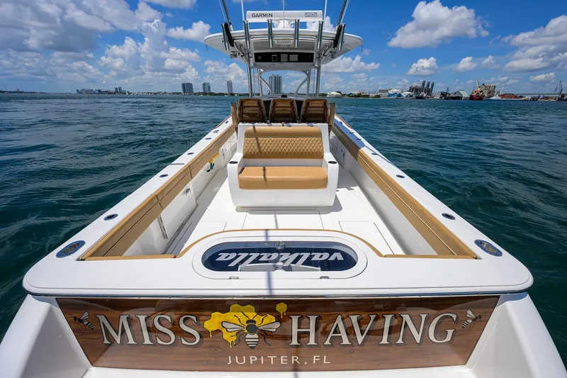 Slide: The Image of 2023 Valhalla Boatworks V-37, "Miss Behaving," docked in Jupiter, FL, under a clear sky. - 50