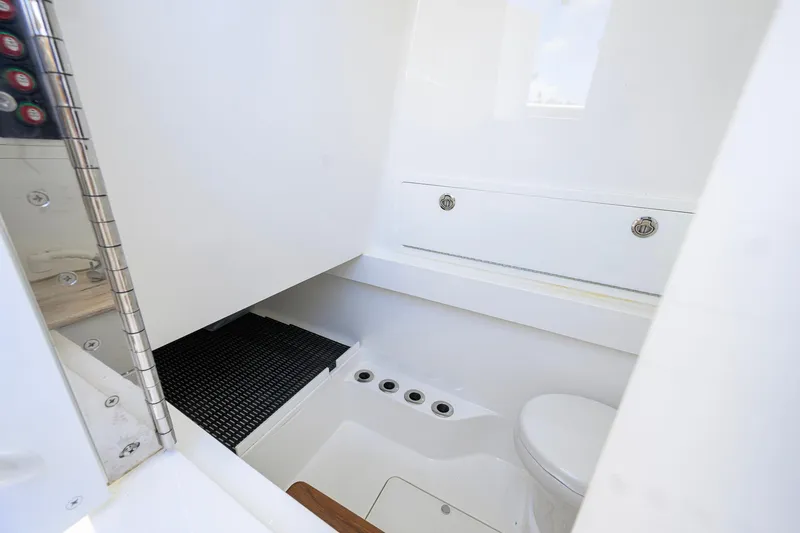 Slide: The Image of 2023 Valhalla Boatworks V-37 interior cabin with modern white design and compact amenities. - 57