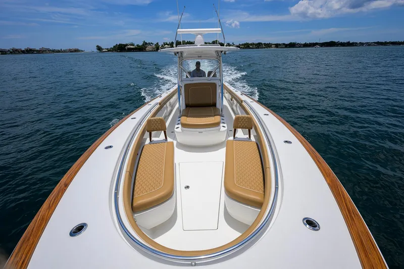 Slide: The Image of 2023 Valhalla Boatworks V-37 cruising on open water, showcasing luxurious seating and sleek design. - 29