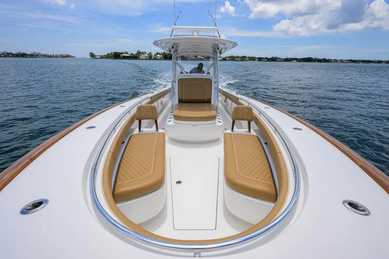 Slide: The Image of 2023 Valhalla Boatworks V-37 cruising on open water, featuring luxurious seating and sleek design. - 30