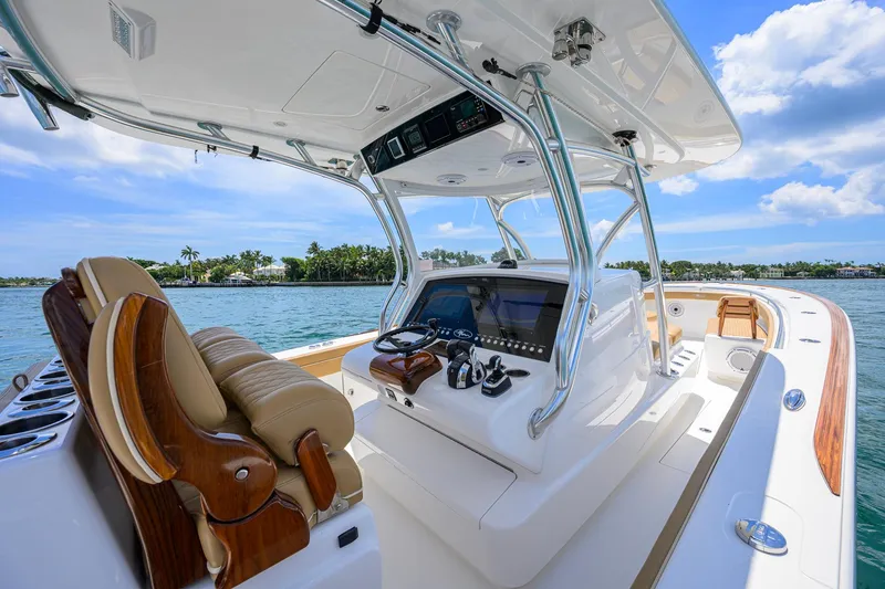Slide: The Image of 2023 Valhalla Boatworks V-37 cockpit with luxurious seating and advanced navigation system. - 16