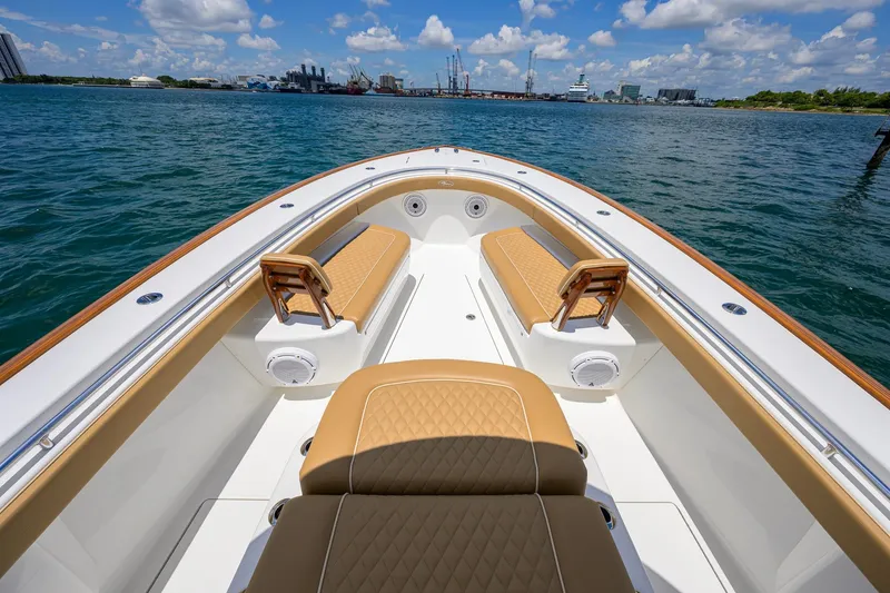 Slide: The Image of 2023 Valhalla Boatworks V-37 with tan seating, cruising on a sunny day. - 24