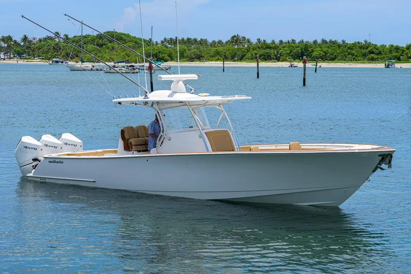 Slide: The Image of 2023 Valhalla Boatworks V-37 in calm waters, featuring triple outboard engines. - 1