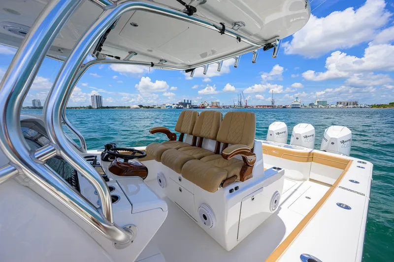 Slide: The Image of 2023 Valhalla Boatworks V-37 on water, featuring luxurious seating and powerful engines. - 19